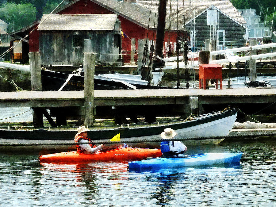 Boat - Orange and Blue Kayaks Photograph by Susan Savad