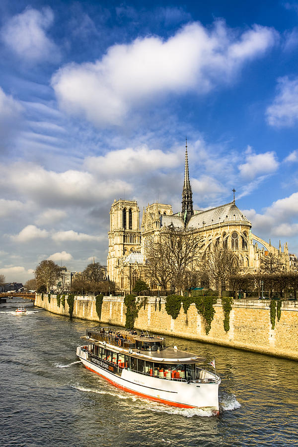 Boat Passing Notre Dame de Paris  Photograph by Mark Tisdale