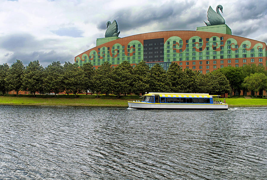 Boat Ride Past The Swan Resort Walt Disney World Photograph by Thomas Woolworth