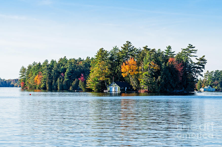 Boathouse on an island Photograph by Les Palenik