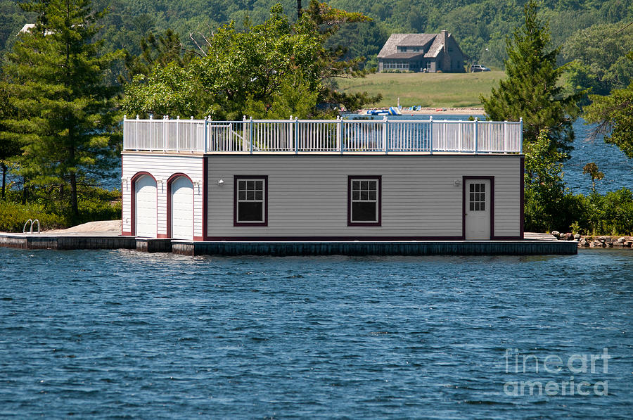 Boathouse with a house Photograph by Les Palenik