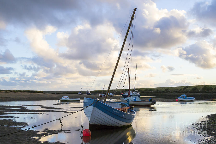 Burnham Photograph - Boats at low tide at Burnham Overy Staithe in the early morning by Keith Douglas