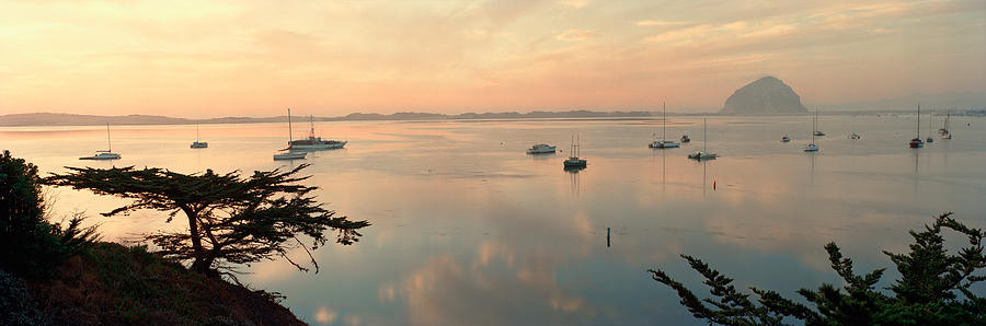 Sunset Photograph - Boats In A Bay With Morro Rock by Panoramic Images