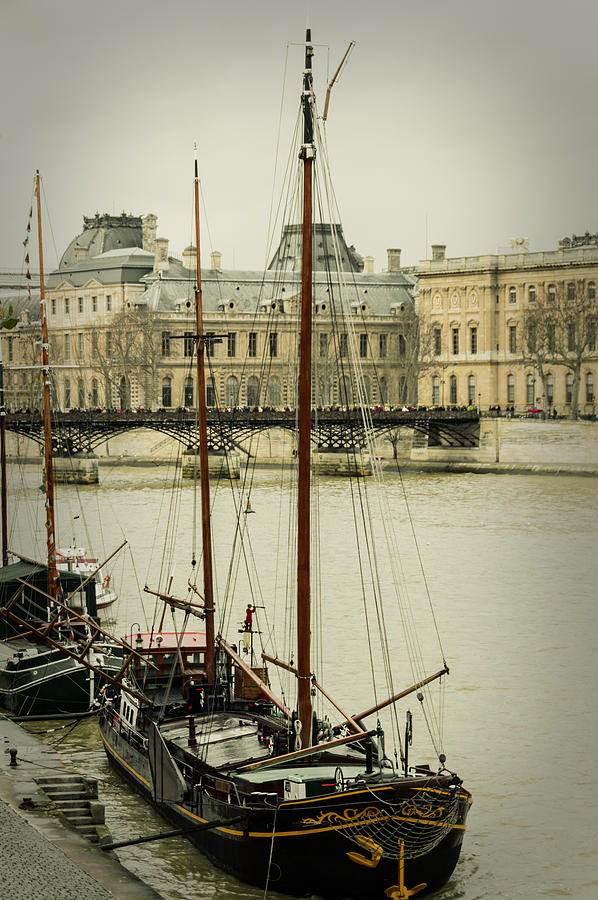 Boats In The Seine River Photograph by Marco Oliveira