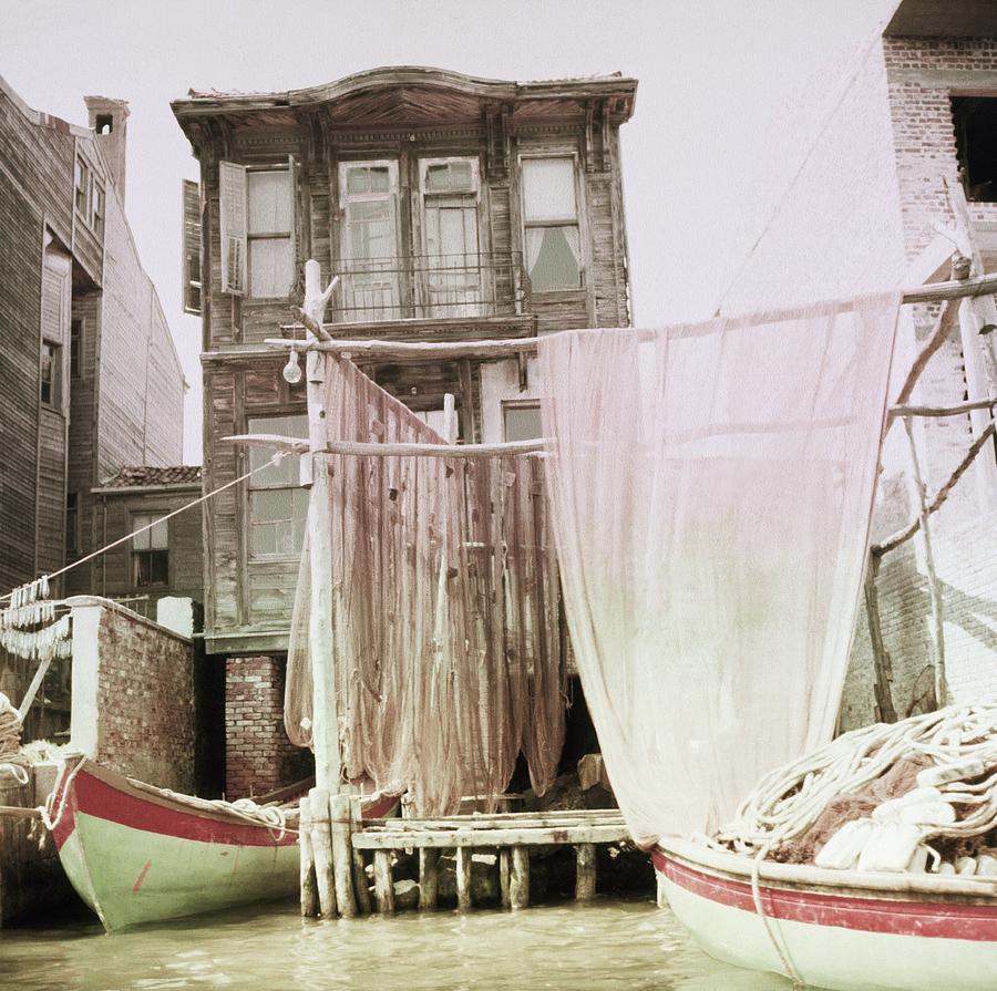 Boats Moored By A House In Turkey Photograph by Horst P. Horst