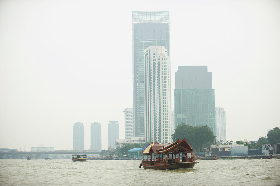 Boats Sailing On The Chao Phraya River Photograph by Mike Harrington