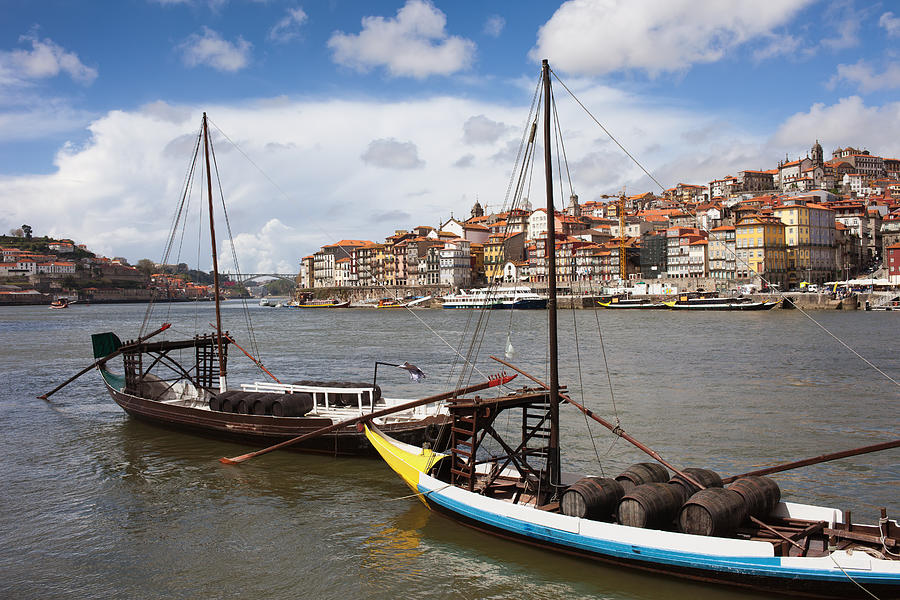 Boats with Wine Barrels on Douro River in Porto Photograph by Artur Bogacki