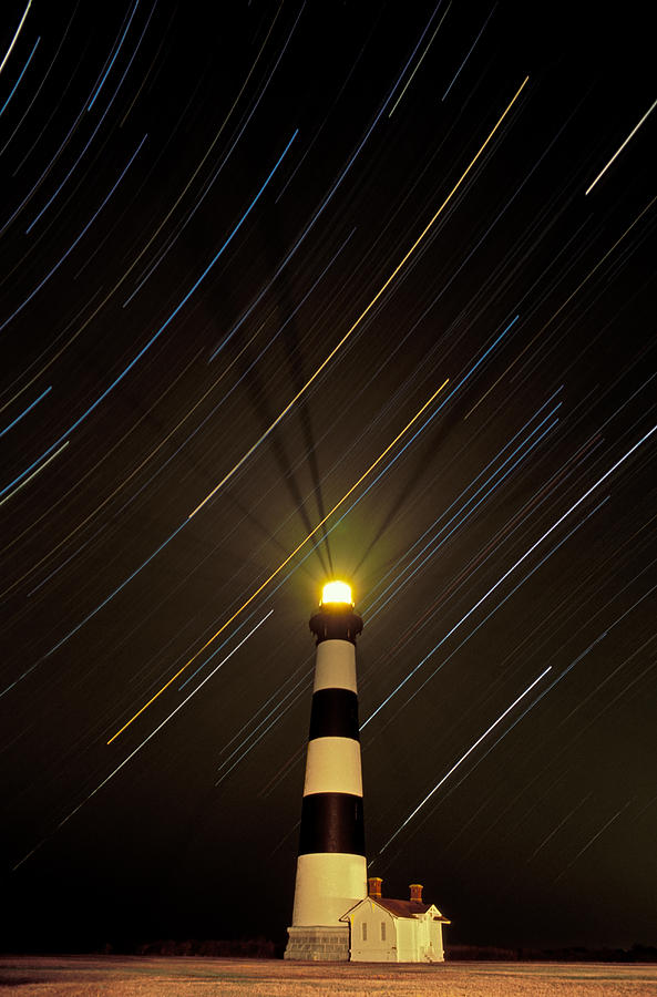 Lighthouse Photograph - Bodie Island Lighthouse and star trails by Kevin Adams