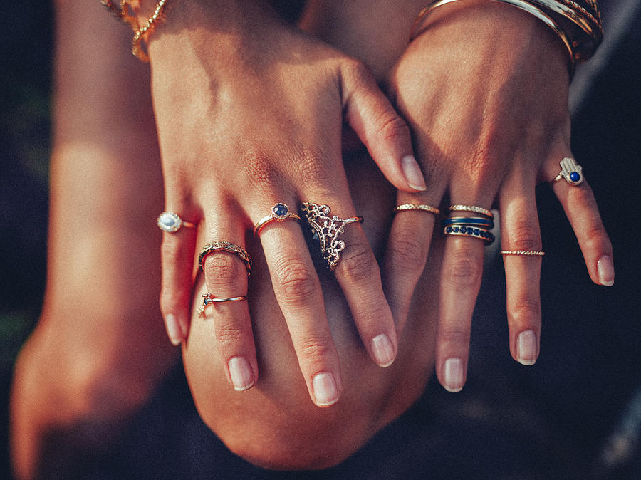 Boho girls hands looking feminine with many rings Photograph by Wundervisuals