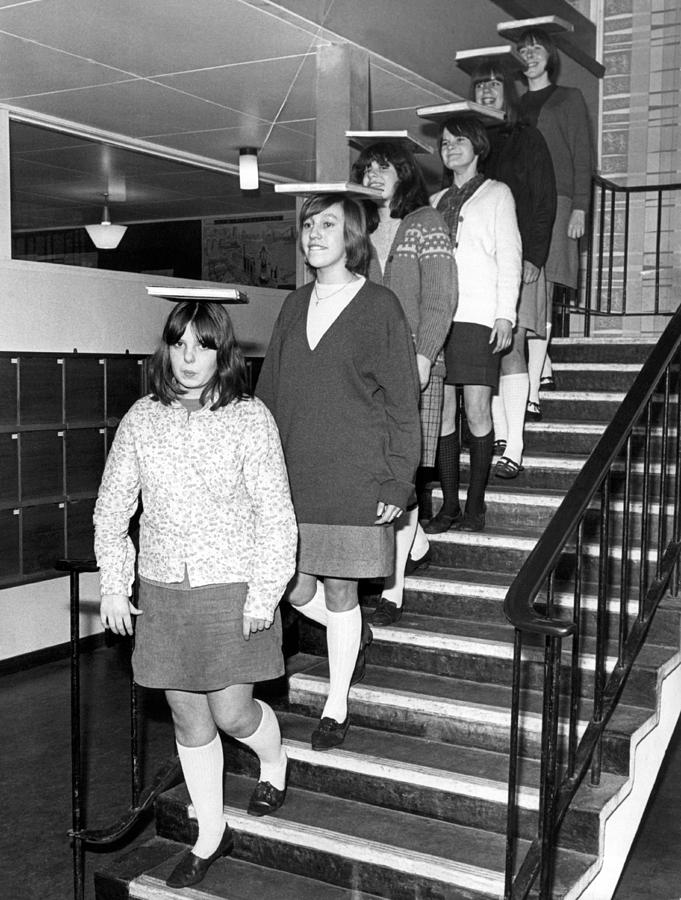 Black And White Photograph - Books Descending A Staircase by Underwood Archives