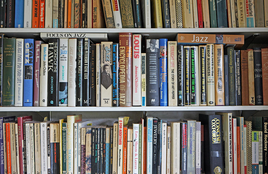 Books on shelves Photograph by Richard Newstead