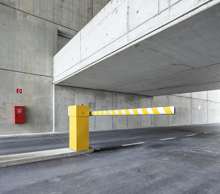 Boom barrier in car park Photograph by Jorg Greuel
