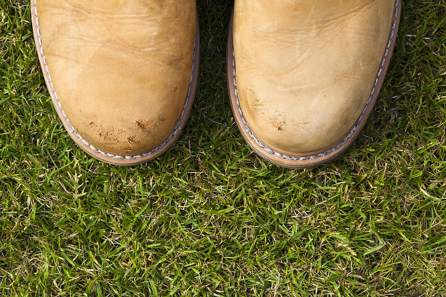 Boots on grass Photograph by Jim Orr