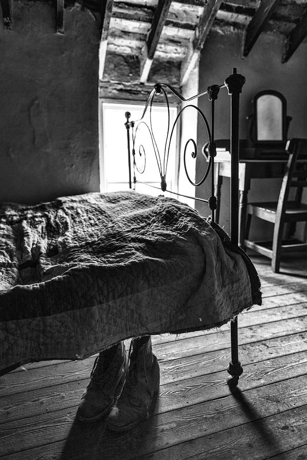 Boots under the bed Photograph by Nigel R Bell