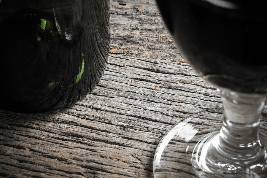 Wine Photograph - Bottle of Wine and Glass of Red Wine on Rustic Table by Brandon Bourdages