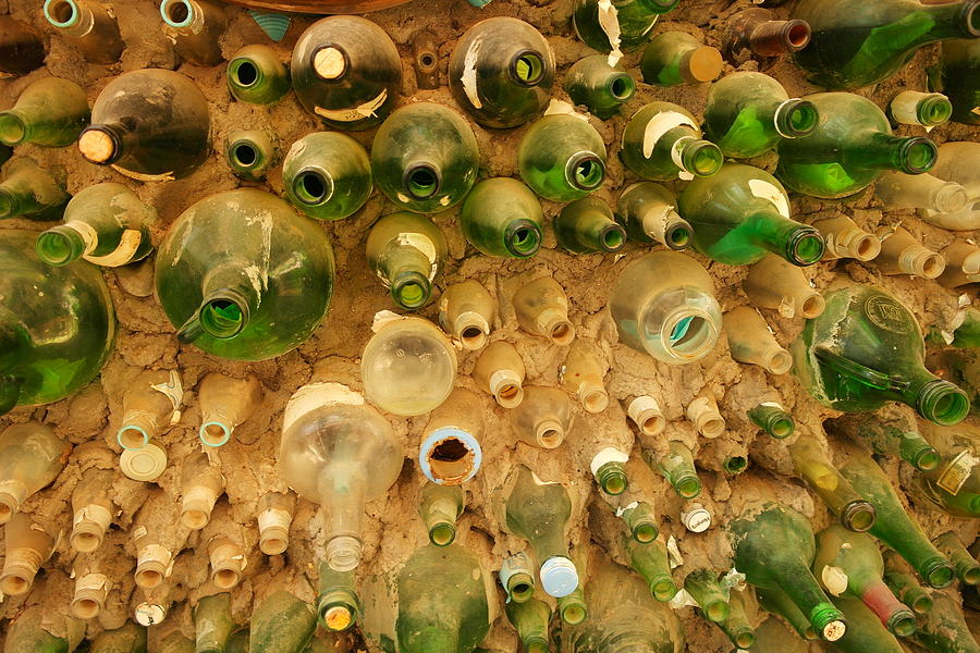 Bottles In The Wall Photograph by Jeff Swan