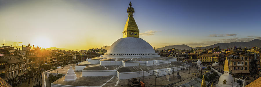 Boudhanath iconic Buddhist stupa and pilgrims at sunset Kathmandu Nepal Photograph by fotoVoyager