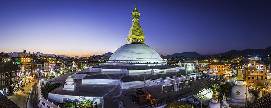 Boudhanath Stupa iconic Buddhist temple illuminated at sunset Kathmandu Nepal Photograph by fotoVoyager