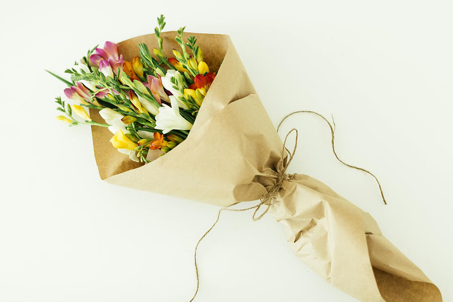 Bouquet wrapped in paper Photograph by Jessica Peterson