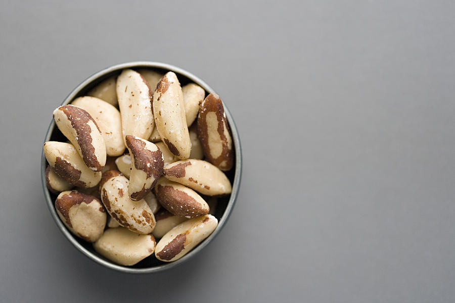 Bowl of brazil nuts Photograph by Image Source
