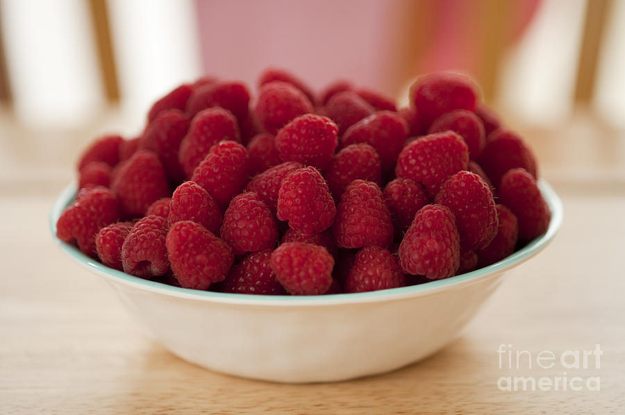 Bowl Of Raspberries On Table Photograph by Jim Corwin