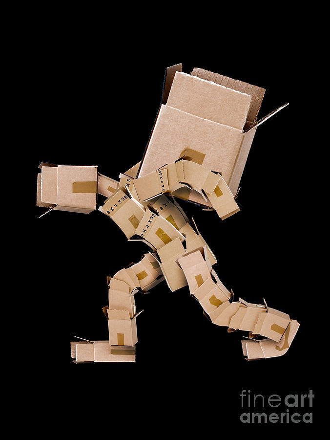 Box character carrying large box Photograph by Simon Bratt