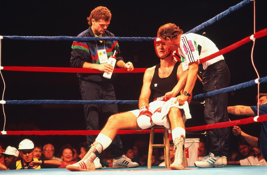 Boxer sitting in corner of ring with coach,trainer Photograph by Kevin Morris