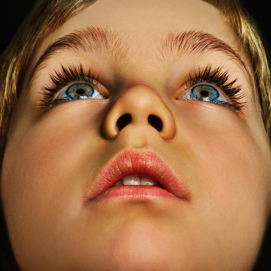 Boy (4-6) looking up, close up (Digital Enhancement) Photograph by Gandee Vasan