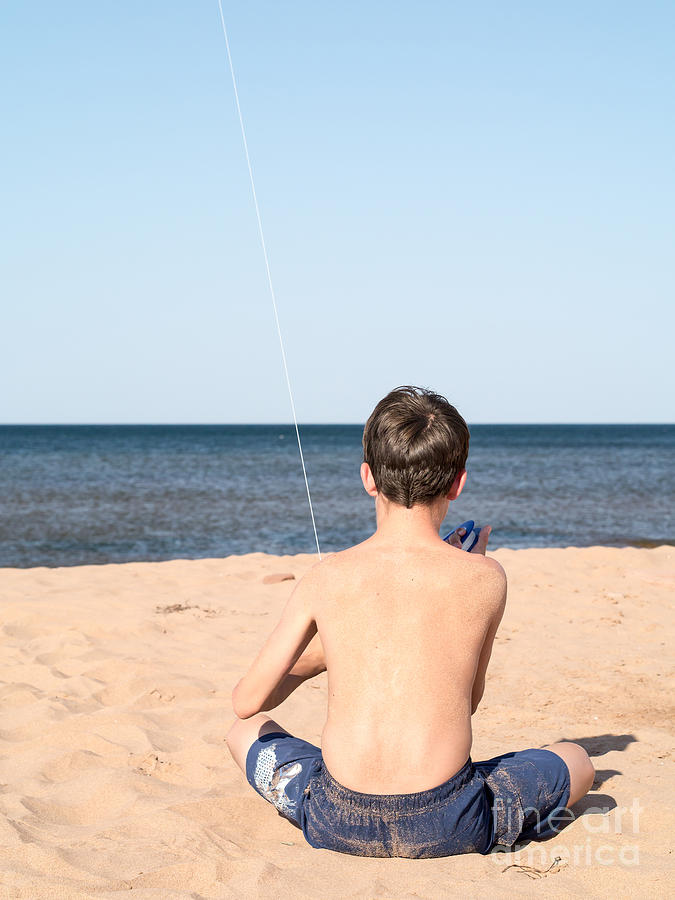 Summer Photograph - Boy at the beach flying a kite by Edward Fielding