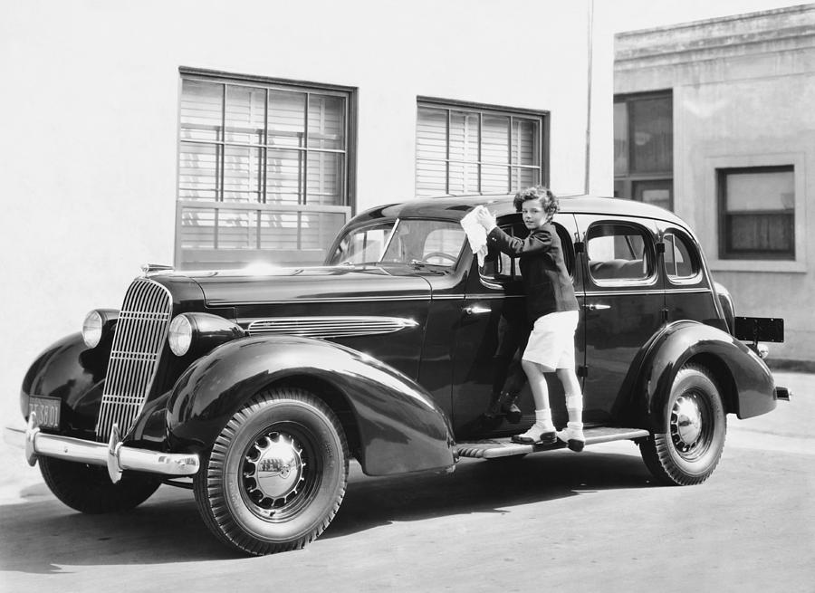 Boy Cleaning A Car Photograph by Underwood Archives