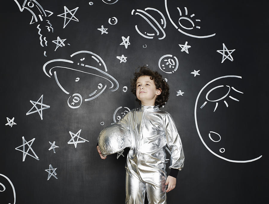 Boy dressed as an astronaut Photograph by Flashpop