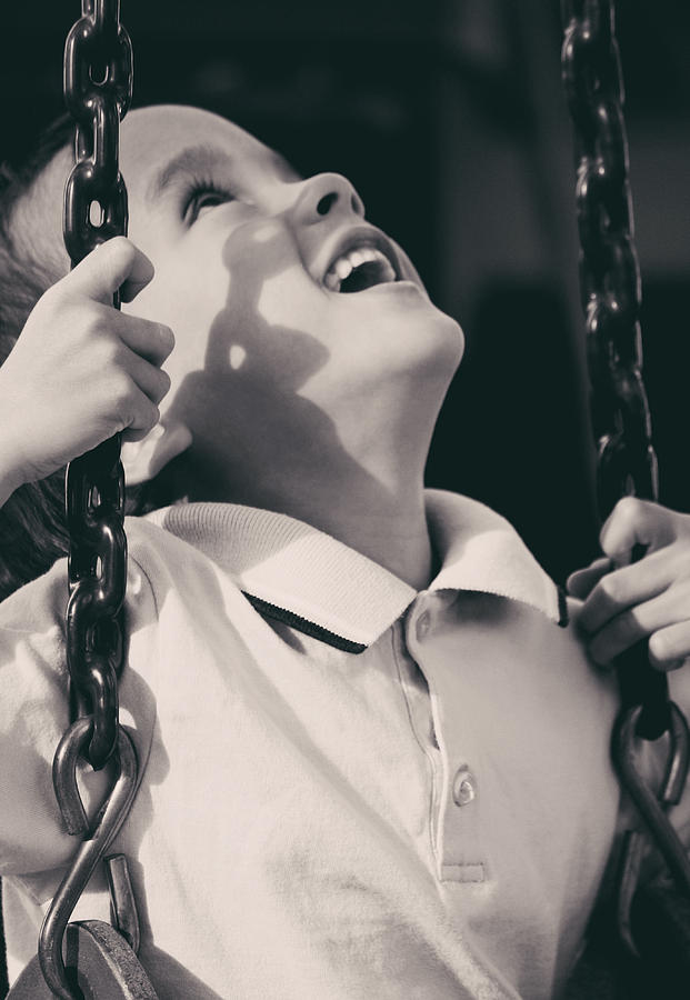 Black And White Photograph - Boy Having Fun On The Swing by Ester McGuire
