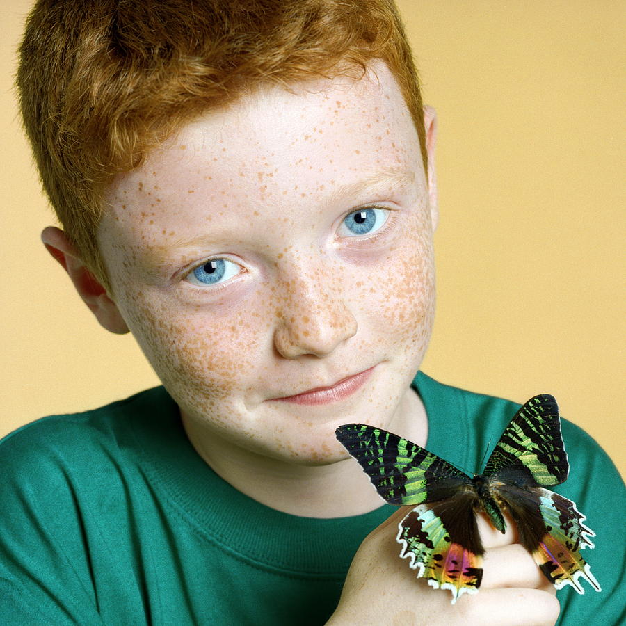 Butterfly Photograph - Boy Holding A Butterfly by Richard Bailey/science Photo Library