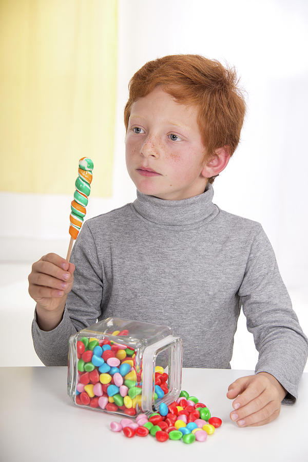 Boy Holding Lollipop With Jar Of Sweets Photograph by Science Photo Library Boy Holding Lollipop With Jar Of Sweets Photograph by Science Photo Library
