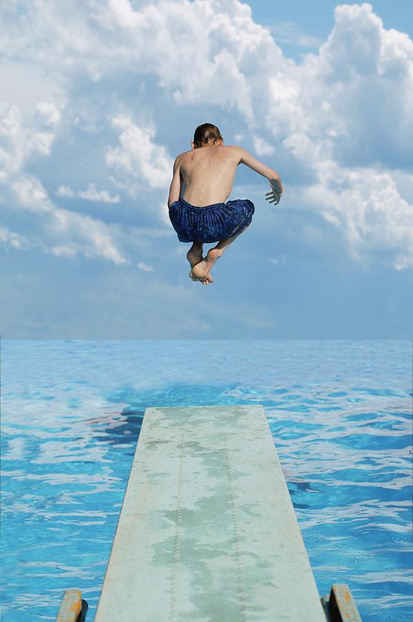 Boy Jumps Into Water Photograph
