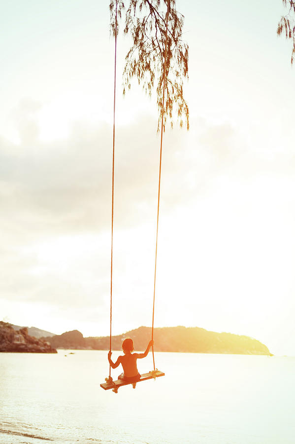 Boy On A Rope Swing Photograph by Arand