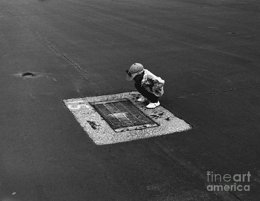 Boy on Grate Photograph by Tom Brickhouse