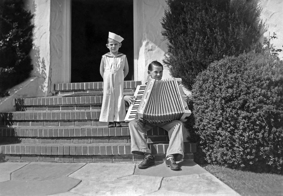 Boy Playing Accordian On Steps Photograph by Underwood Archives