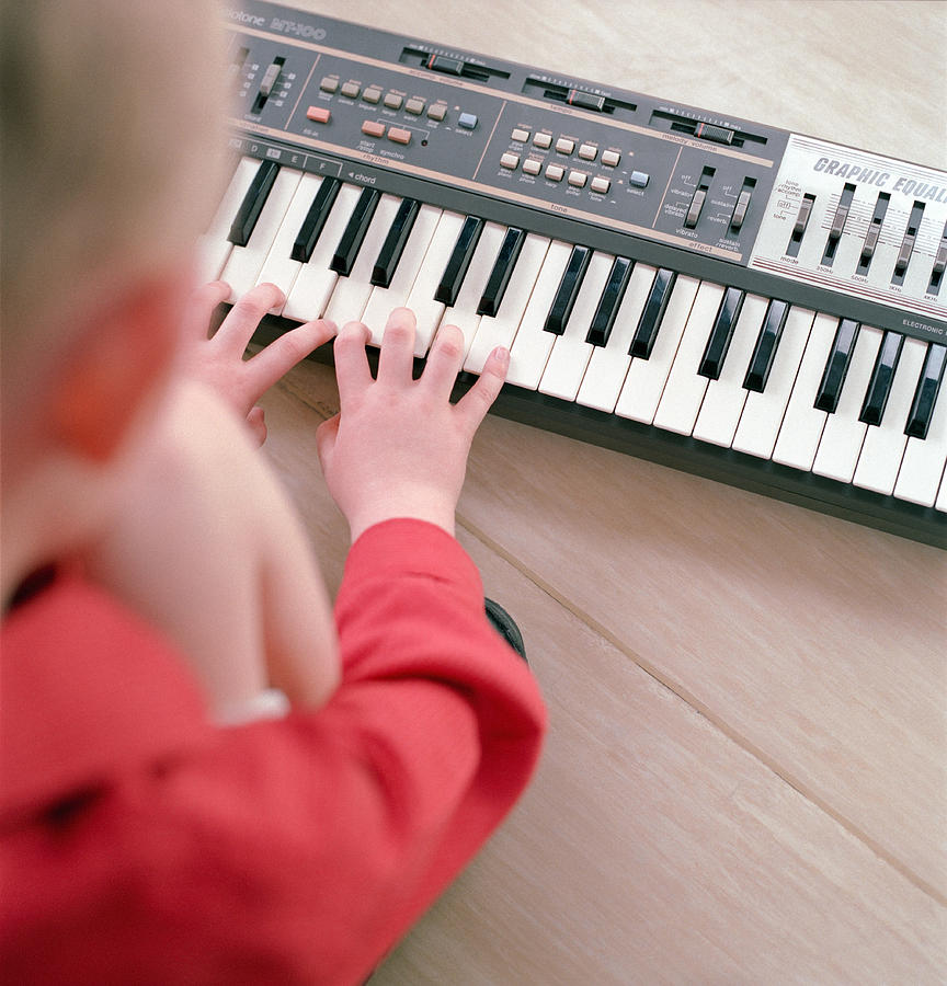 Boy Playing Keyboard Photograph by Richard Kolker