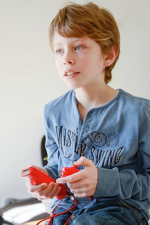Device Photograph - Boy Playing Wii Video Game by Aj Photo