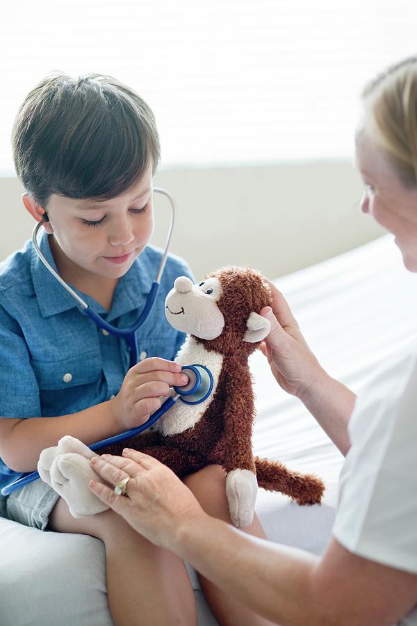 Boy Playing With Stethoscope And Teddy Bear Photograph By Science Photo 