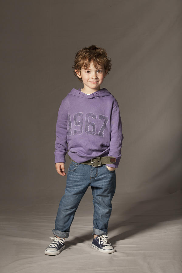 Boy smiling in studio Photograph by Patrick Wittmann