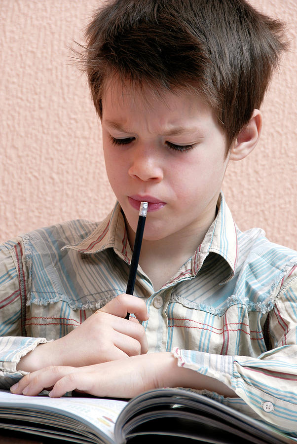 Boy Studying Photograph By Aj Photoscience Photo Library Fine Art