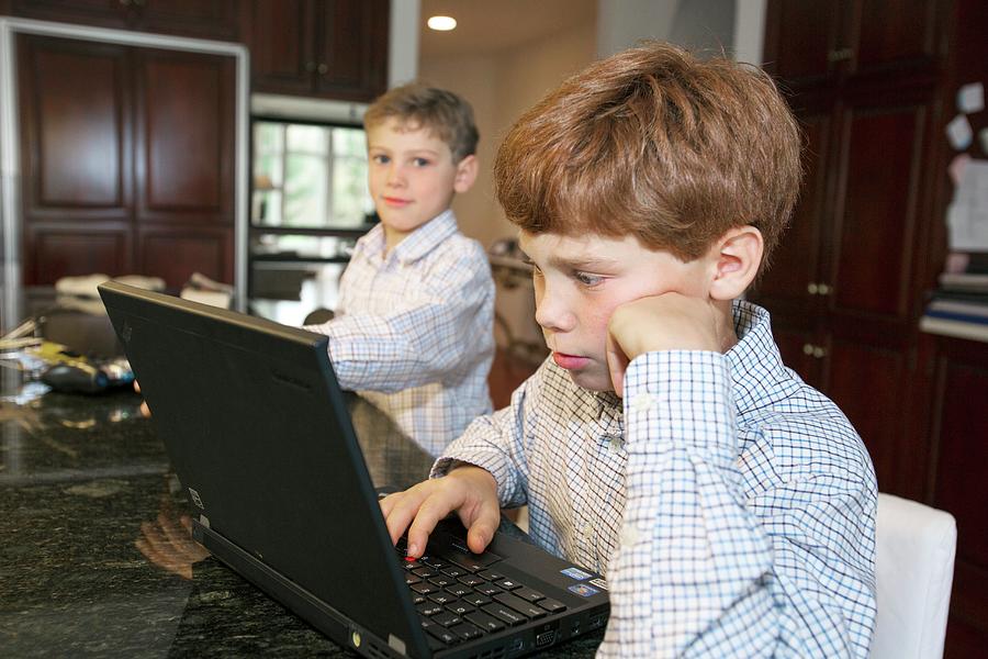 Boy Using A Laptop Photograph by Jim West - Fine Art America