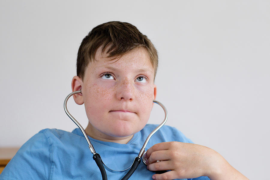 Portrait Photograph - Boy Using A Stethoscope by Gombert, Sigrid