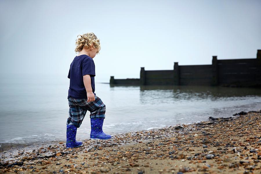 Boy Walking On Beach Photograph by Ruth Jenkinson - Fine Art America