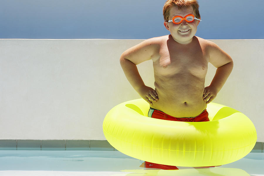 Boy Wearing Inner Tube Photograph by Fuse