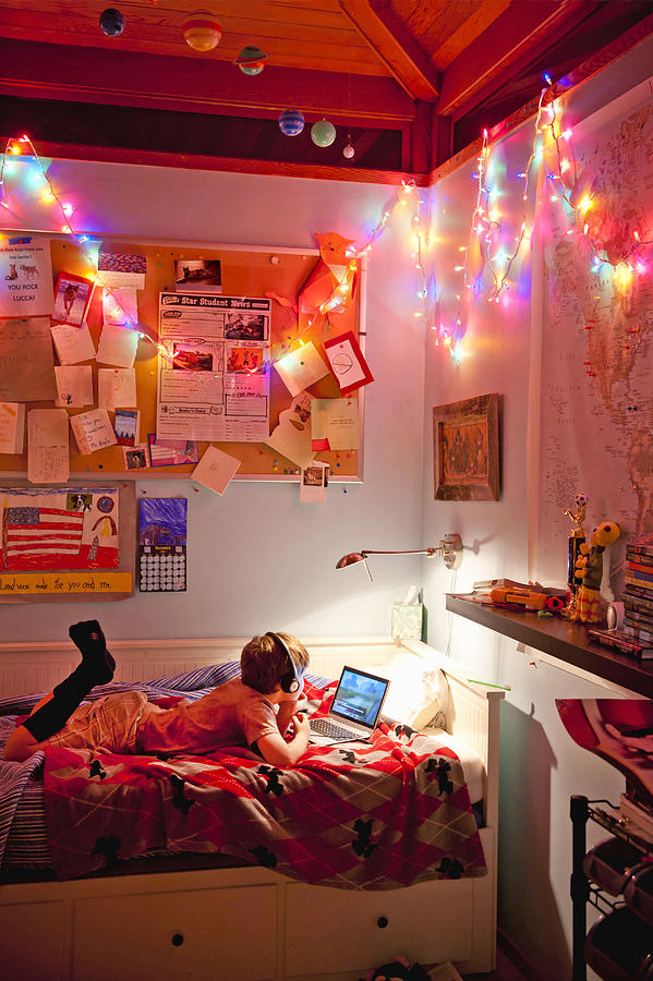 Boy With Laptop On His Bed, Messy Room With Lights Photograph by Stephen Simpson