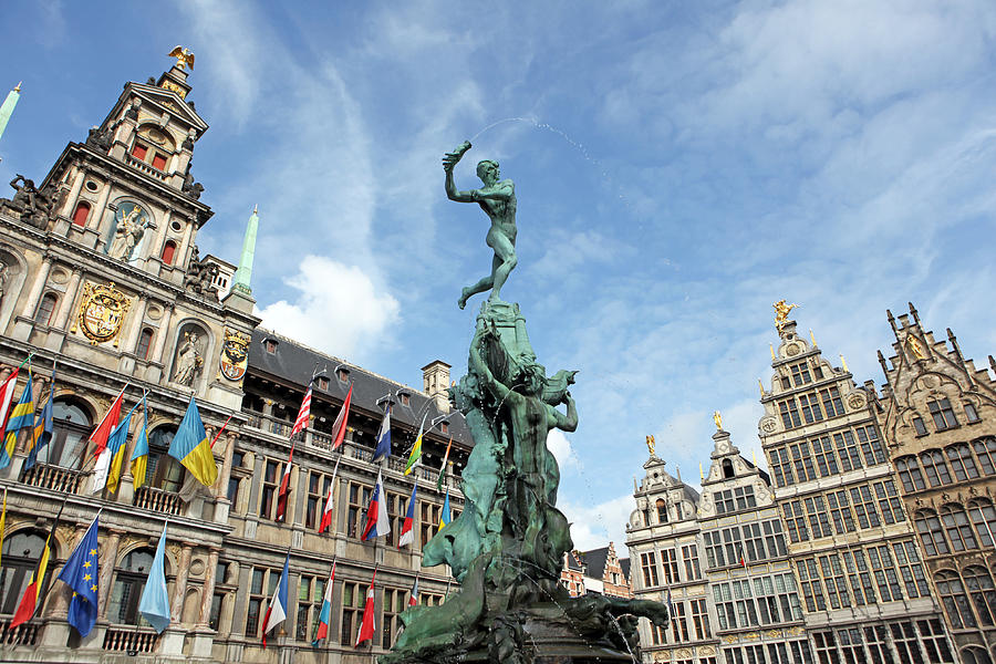 Brabo Statue and City Hall of Antwerp Belgium Photograph by JurgaR