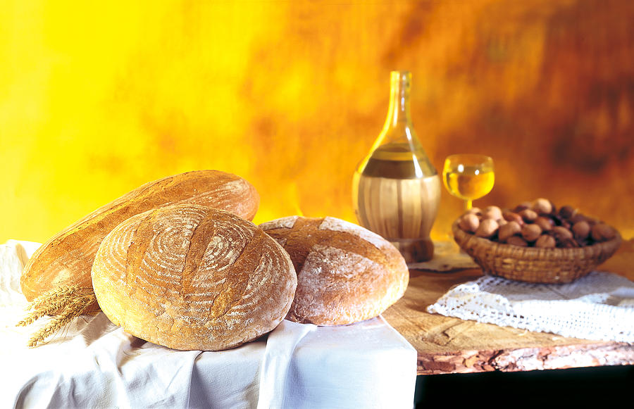 Bread On Wooden Table Photograph